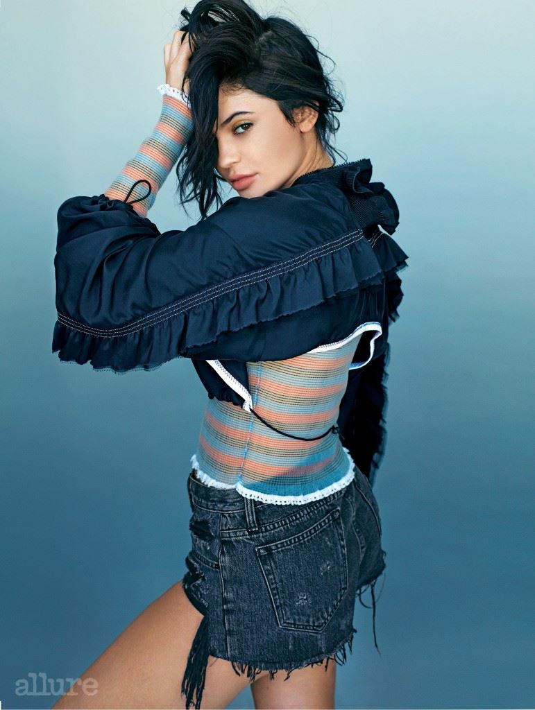 Cover feature, interview with Kylie Jenner, social issue, powerhouse, portrait, wears detailed jacket, striped top, denim shorts