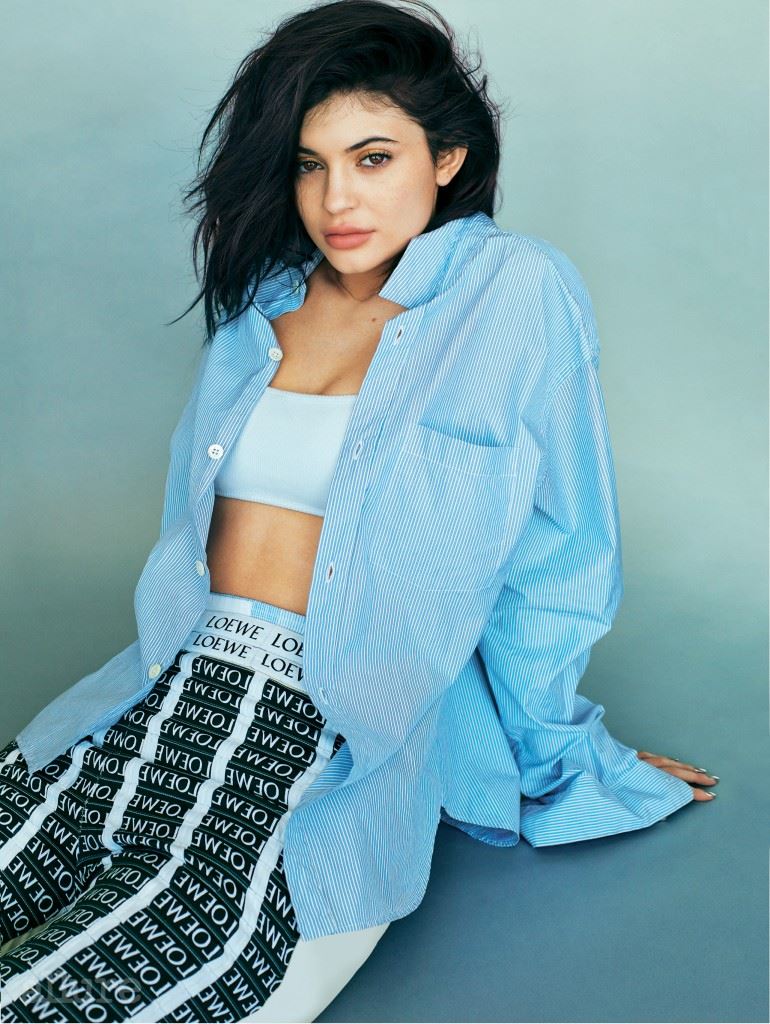 Cover feature, interview with Kylie Jenner, social issue, powerhouse, portrait, wears striped shirt, bandeau bra, Loewe trousers