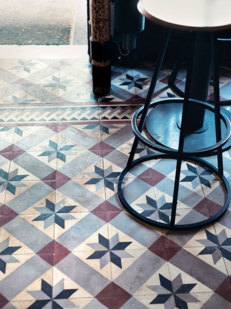 relates to feature, Little Mix, French food scene, cuisine, interiors of Clown Bar, tiled flooring, bar stool