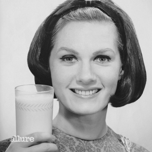 UNITED STATES - CIRCA 1950s:  Woman holding glass of milk.  (Photo by George Marks/Retrofile/Getty Images)