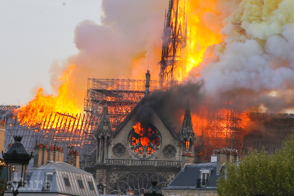 Firefighters battle to extinguish a giant fire that engulfed the Notre Dame Cathedral in Paris, France on April 15, 2019. A huge fire swept through the roof of the famed Notre-Dame Cathedral in the French capital, sending flames and huge clouds of grey smoke billowing into the sky. The flames and smoke plumed from the spire and roof of the gothic cathedral, visited by millions of people a year. Pictured: Cath?drale Notre-Dame de Paris Ref: SPL5080277 150419 NON-EXCLUSIVE Picture by: SplashNews.com Splash News and Pictures Los Angeles: 310-821-2666 New York: 212-619-2666 London: 0207 644 7656 Milan: 02 4399 8577 photodesk@splashnews.com World Rights, No Argentina Rights, No Belgium Rights, No Czechia Rights, No Finland Rights, No France Rights, No Germany Rights, No Italy Rights, No Mexico Rights, No Norway Rights, No Peru Rights, No Portugal Rights, No Spain Rights, No Switzerland Rights, No United Kingdom Rights